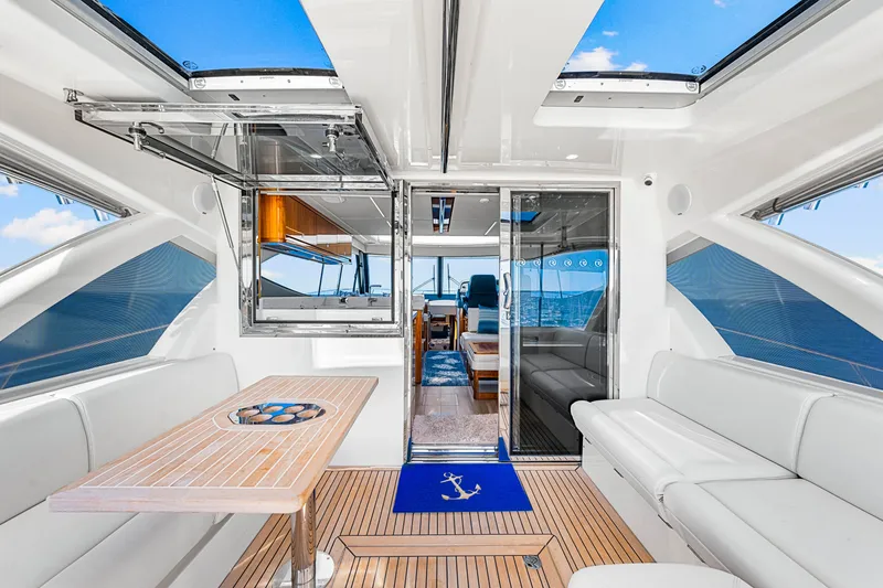 Slide: The Image of Luxurious interior of 2022 Riviera 505 SUV yacht with elegant seating and ocean view. - 41
