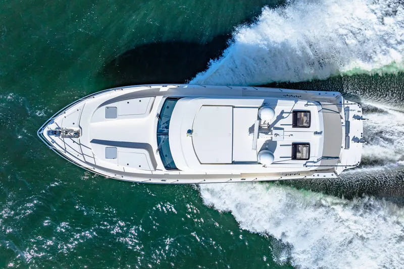 Slide: The Image of Aerial view of 2022 Riviera 505 SUV yacht cruising on the ocean. - 5