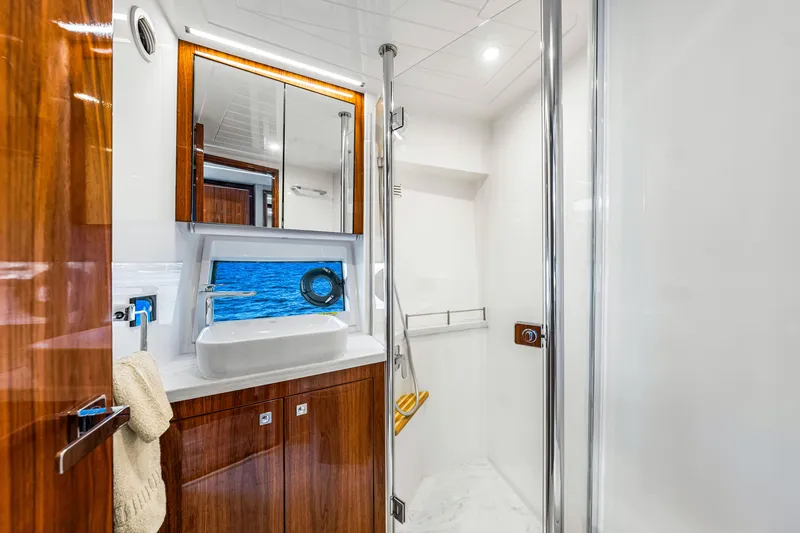 Slide: The Image of Luxurious bathroom interior of 2022 Riviera 505 SUV yacht with ocean view. - 15
