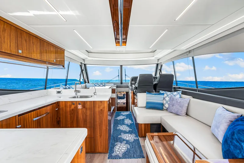 Slide: The Image of Luxurious interior of 2022 Riviera 505 SUV yacht with ocean view. - 36
