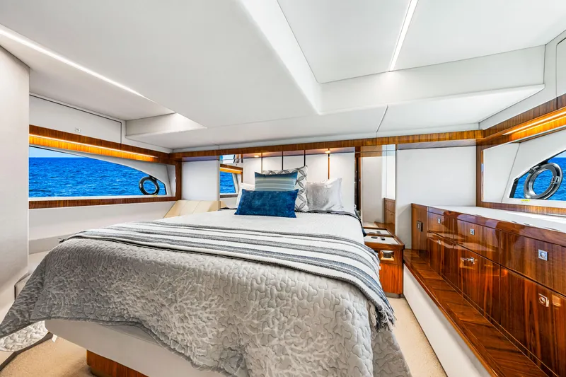 Slide: The Image of Luxurious bedroom interior of 2022 Riviera 505 SUV yacht with ocean view. - 21