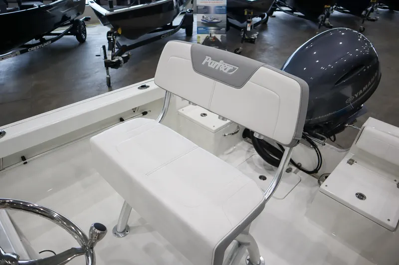 Slide: The Image of 2025 Parker 18SE Center Console boat interior with seating and motor. - 10