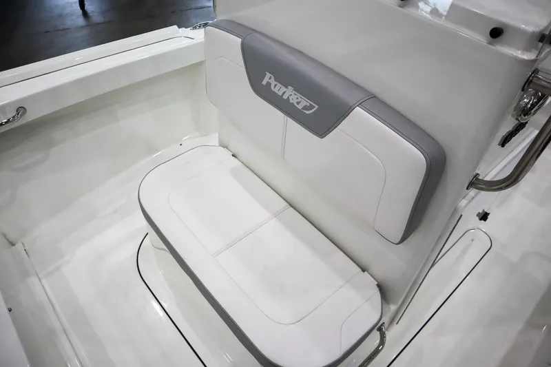 Slide: The Image of 2025 Parker 18SE Center Console boat seat with white and gray upholstery. - 11