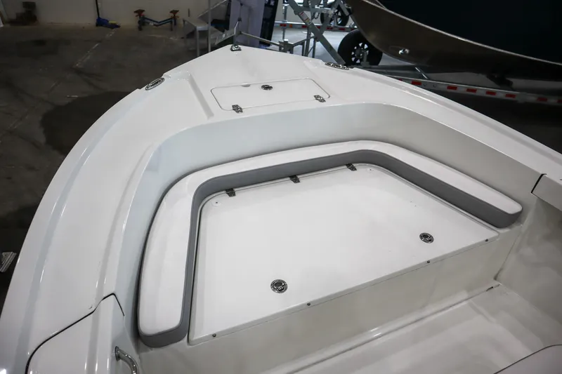 Slide: The Image of 2025 Parker 18SE Center Console boat interior with seating and storage compartments. - 14