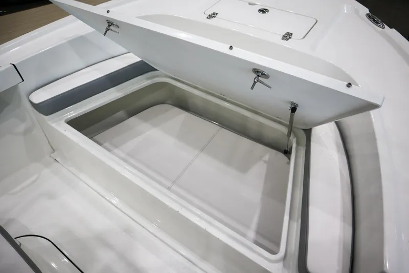 Slide: The Image of Open storage compartment on 2025 Parker 18SE Center Console boat. - 16