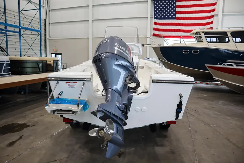 Slide: The Image of 2025 Parker 18SE Center Console boat with Yamaha outboard motor in a showroom. - 4