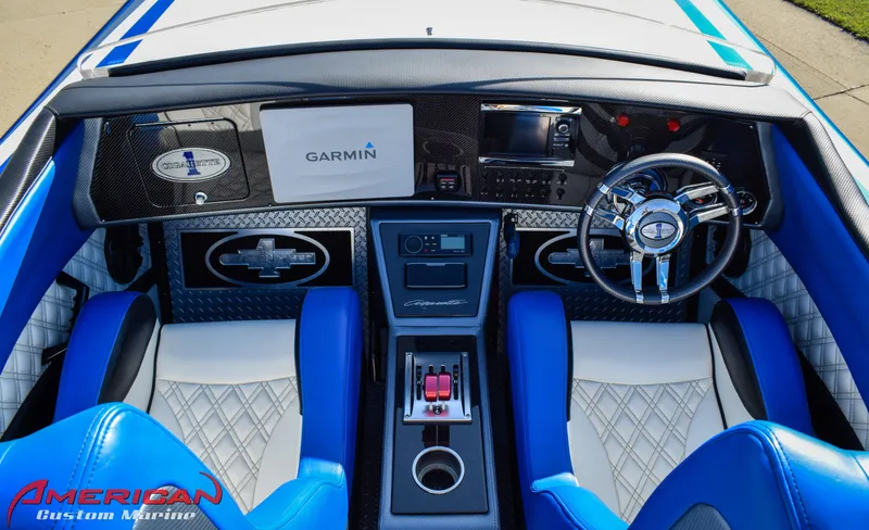 Slide: The Image of Interior of a 2005 Cigarette 45 Maximus boat with blue and white seating, Garmin navigation. - 10