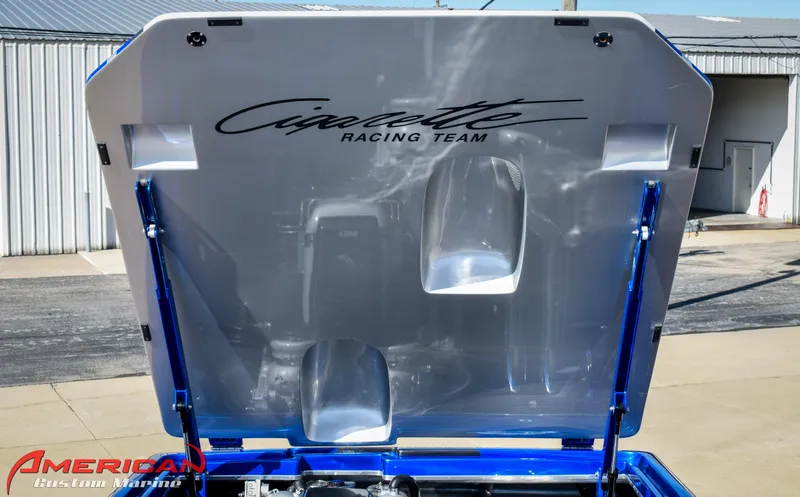 Slide: The Image of 2005 Cigarette 45 Maximus engine cover with logo, displayed outdoors. - 13