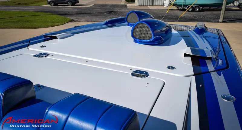 Slide: The Image of 2005 Cigarette 45 Maximus boat with blue and white design, American Custom Marine branding. - 14