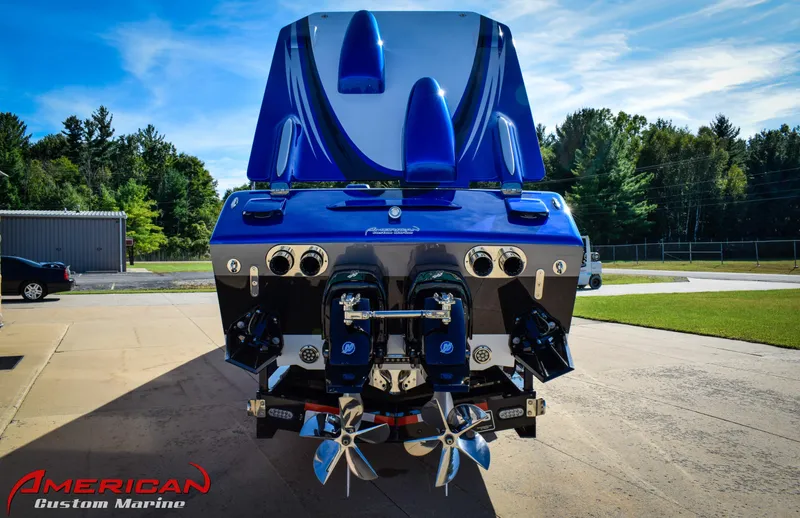 Slide: The Image of 2005 Cigarette 45 Maximus boat with dual engines, displayed outdoors at American Custom Marine. - 4