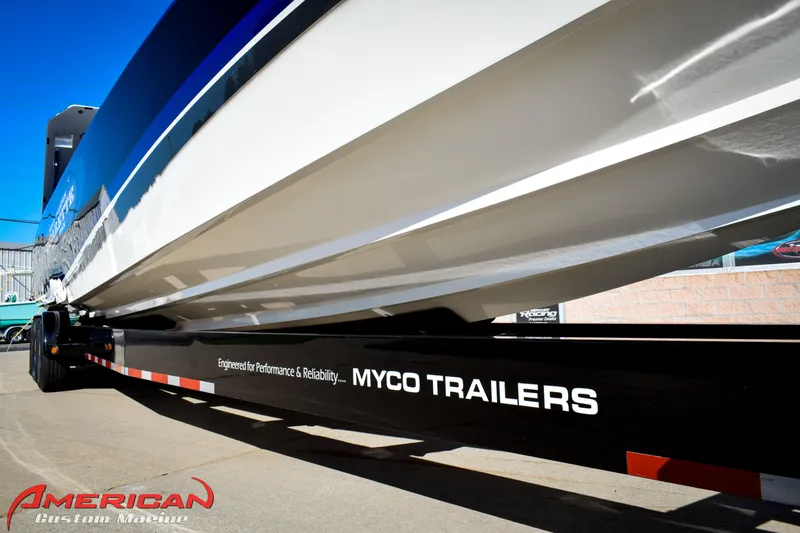 Slide: The Image of 2005 Cigarette 45 Maximus boat on Myco trailer, American Custom Marine branding. - 6