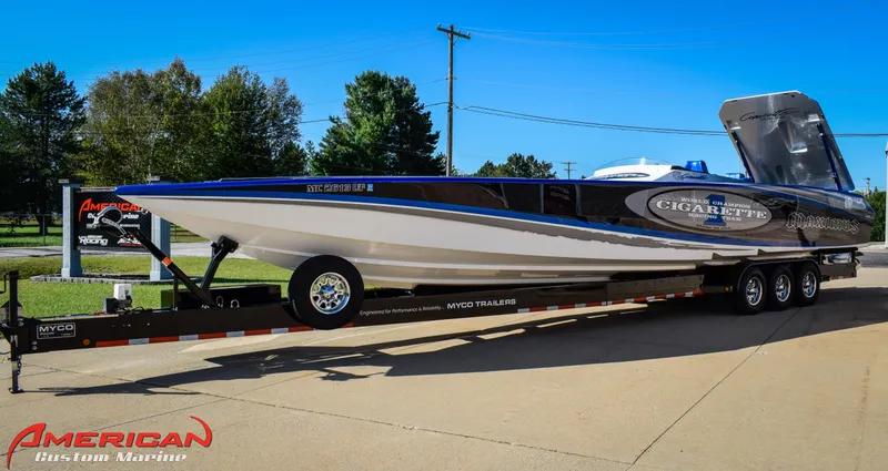 Slide: The Image of 2005 Cigarette 45 Maximus speedboat on trailer, displayed outdoors at American Custom Marine. - 7