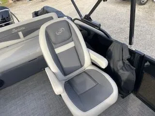 Slide: The Image of 2024 Barletta C22UC boat interior with gray and white seating. - 8