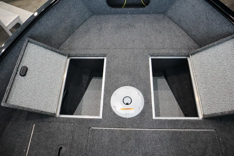 Slide: The Image of 2025 Crestliner 1650 KODIAK WT boat interior with open storage compartments. - 11