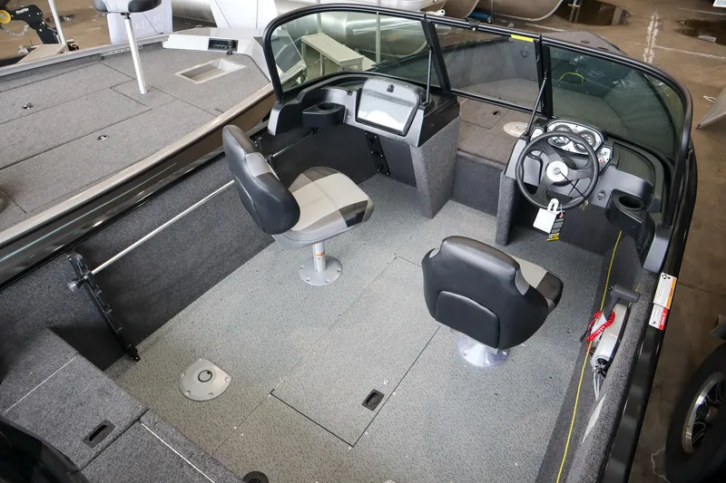 Slide: The Image of 2025 Crestliner 1650 KODIAK WT boat interior with dual seats and steering console. - 6