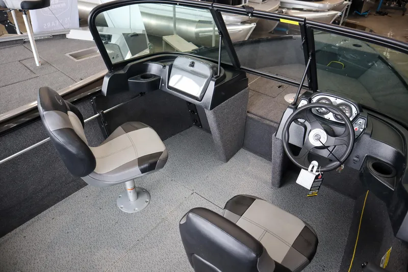 Slide: The Image of 2025 Crestliner 1650 KODIAK WT boat interior with dual seats and steering console. - 7