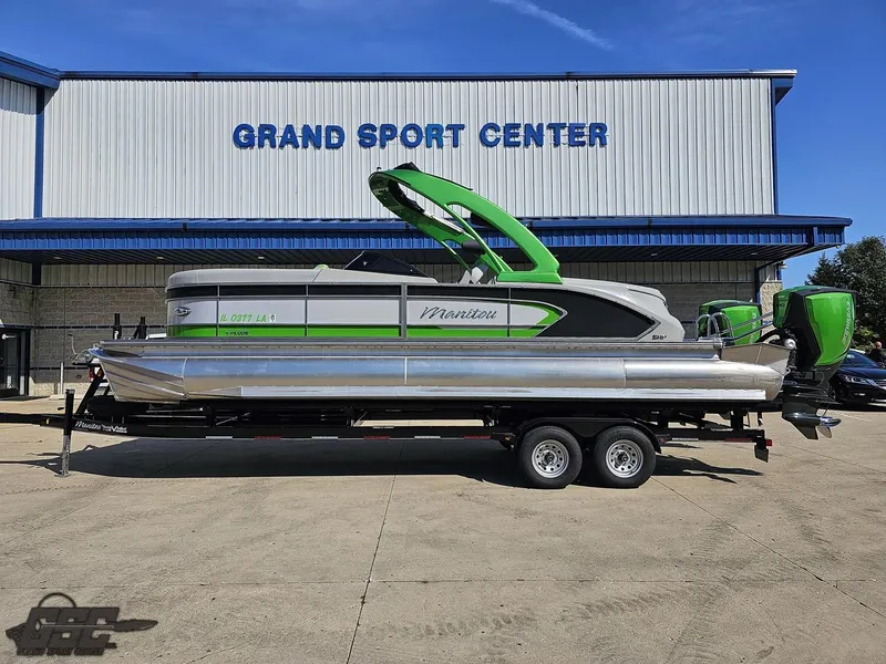 Slide: The Image of 2021 Manitou 25 X-Plode pontoon boat on trailer at Grand Sport Center. - 2