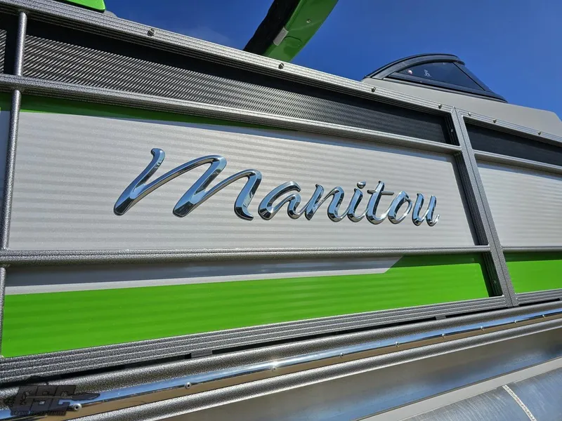 Slide: The Image of 2021 Manitou 25 X-Plode boat with green and silver detailing. - 27