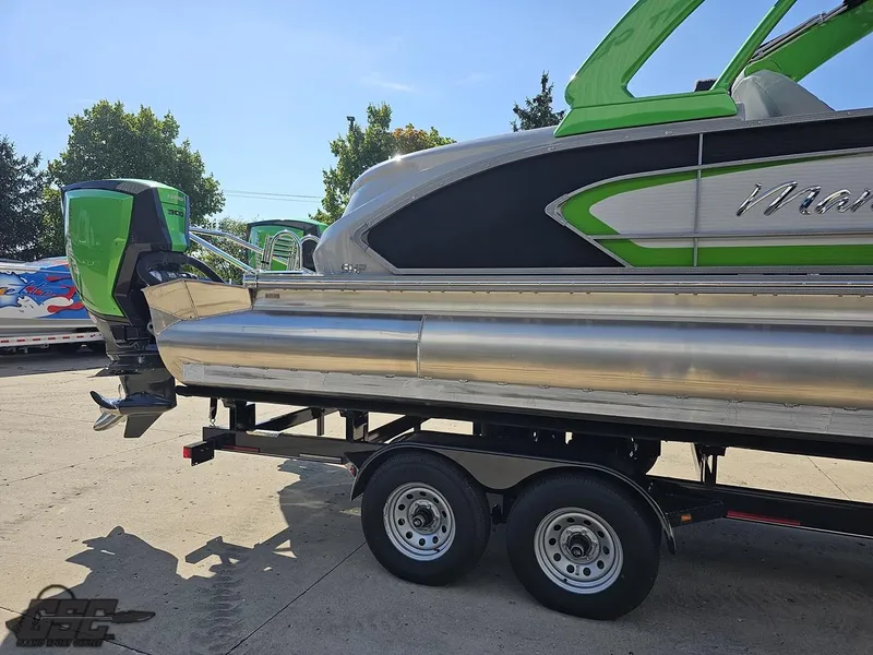 Slide: The Image of 2021 Manitou 25 X-Plode pontoon boat on trailer, featuring green and silver design. - 32