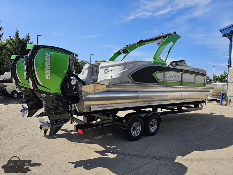 Slide: The Image of 2021 Manitou 25 X-Plode pontoon boat with Evinrude engines on a trailer. - 36