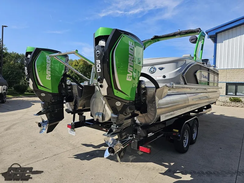 Slide: The Image of 2021 Manitou 25 X-Plode pontoon boat with dual Evinrude engines on a trailer. - 37