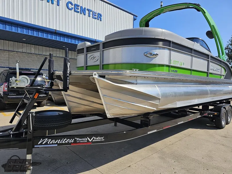 Slide: The Image of 2021 Manitou 25 X-Plode pontoon boat on trailer outside a service center. - 7