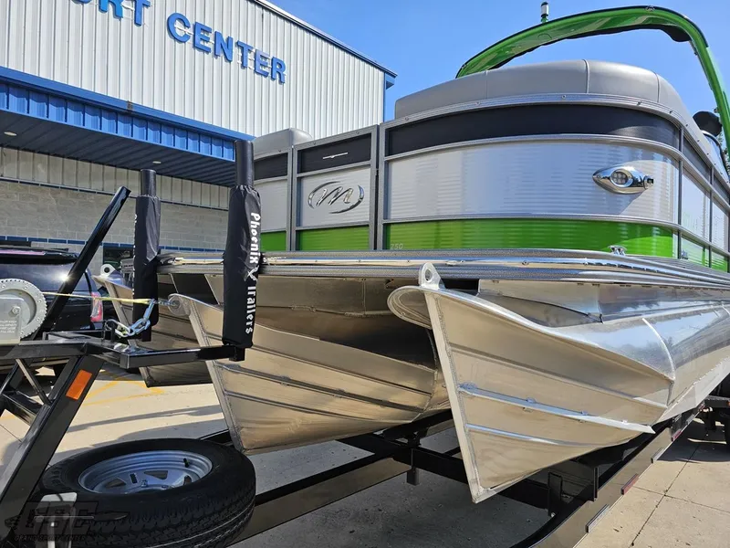 Slide: The Image of 2021 Manitou 25 X-Plode pontoon boat on trailer at a sport center. - 8