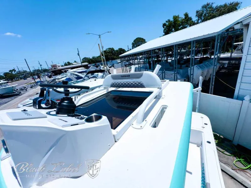 Slide: The Image of 2024 Caymas 281 HB boat docked at marina under clear blue sky. - 16