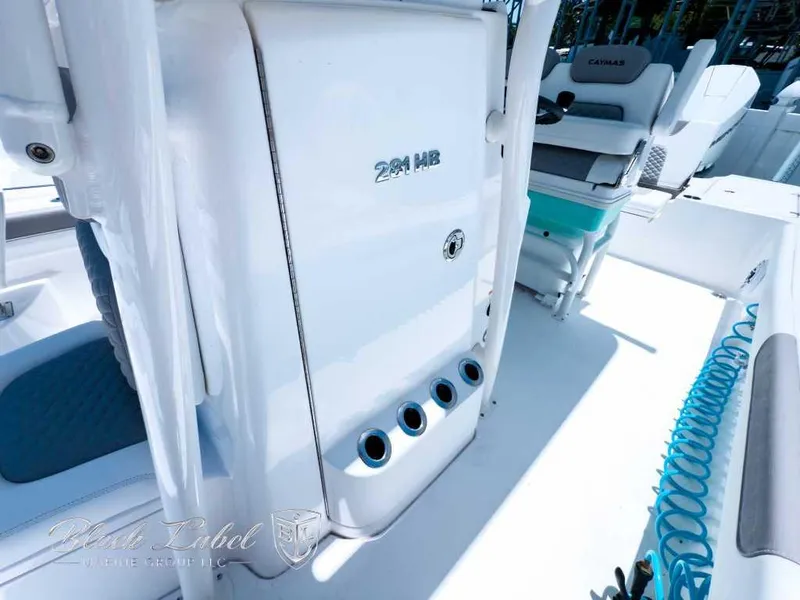 Slide: The Image of 2024 Caymas 281 HB boat interior with seating and storage features. - 17