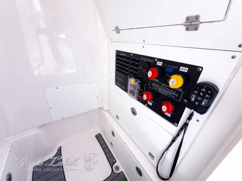 Slide: The Image of 2024 Caymas 281 HB boat electrical panel with controls and switches. - 20