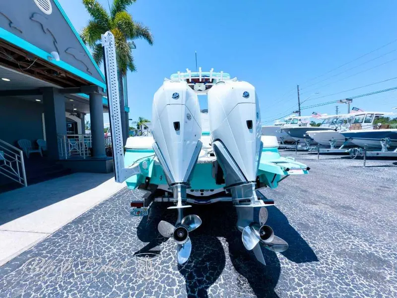 Slide: The Image of 2024 Caymas 281 HB boat in a manufacturing facility, showcasing its sleek design. - 4