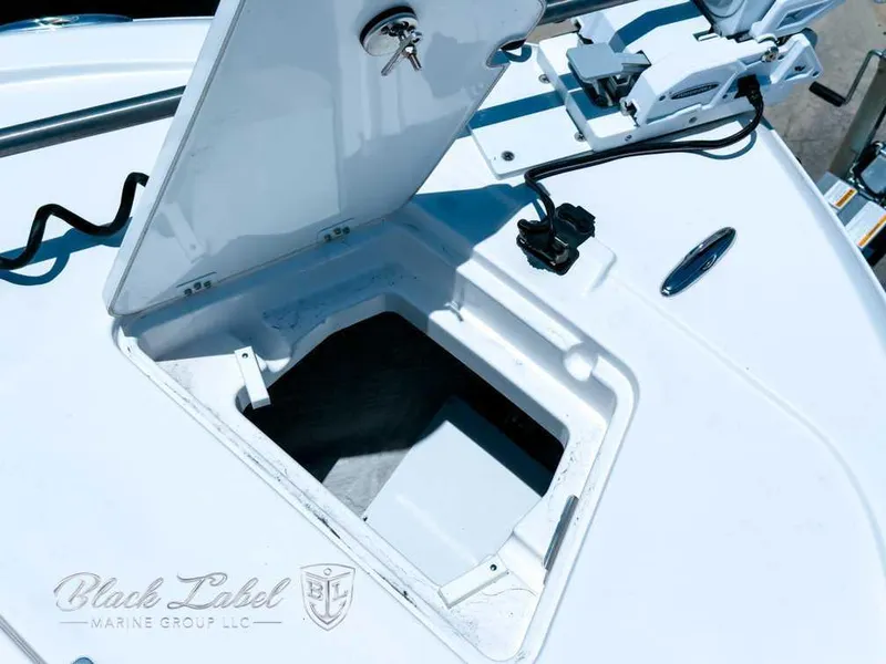 Slide: The Image of 2024 Caymas 281 HB boat deck view in a marina setting. - 9