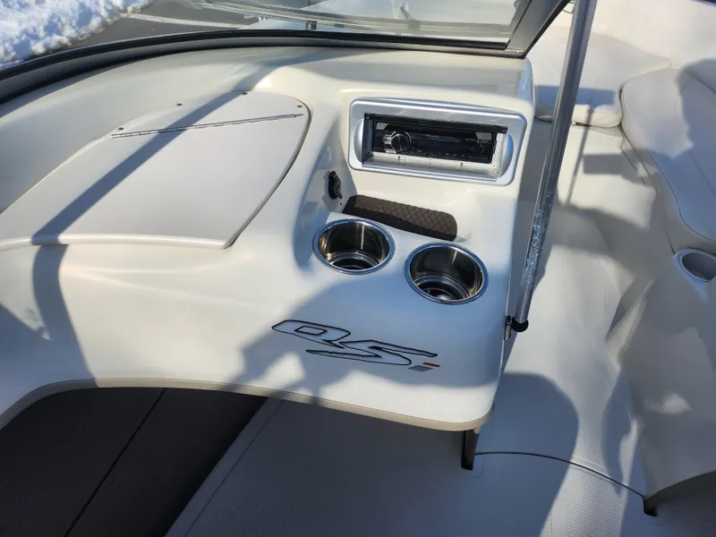 Slide: The Image of Interior of 2014 Tahoe Q5i SF boat with cup holders and stereo system. - 16