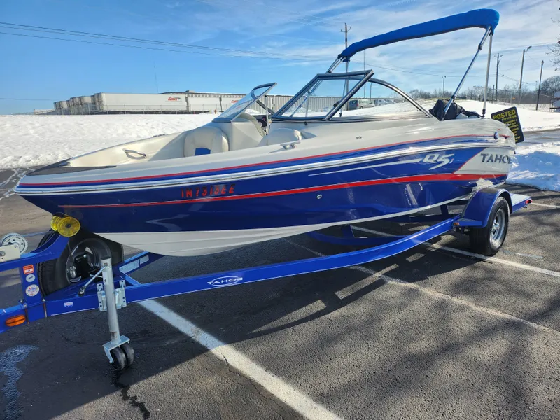 Slide: The Image of 2014 Tahoe Q5i SF boat on trailer in snowy parking lot. - 5