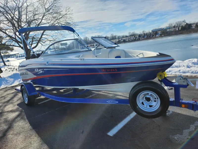 Slide: The Image of 2014 Tahoe Q5i SF boat on trailer by snowy lakeside. - 8