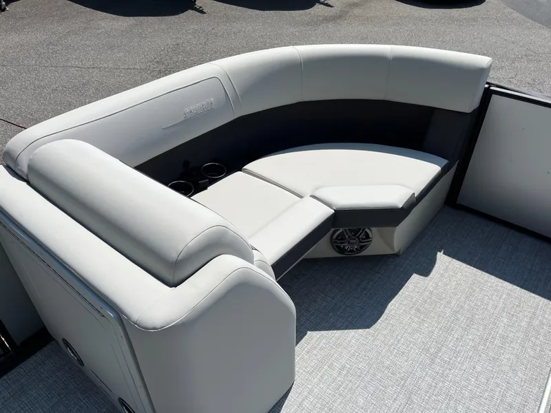 Slide: The Image of Luxurious seating on 2025 Harris Cruiser 210 pontoon boat with cup holders and speaker. - 11