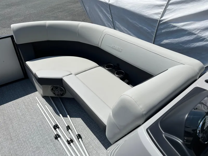 Slide: The Image of 2025 Harris Cruiser 210 boat interior with gray seating and cup holders. - 12
