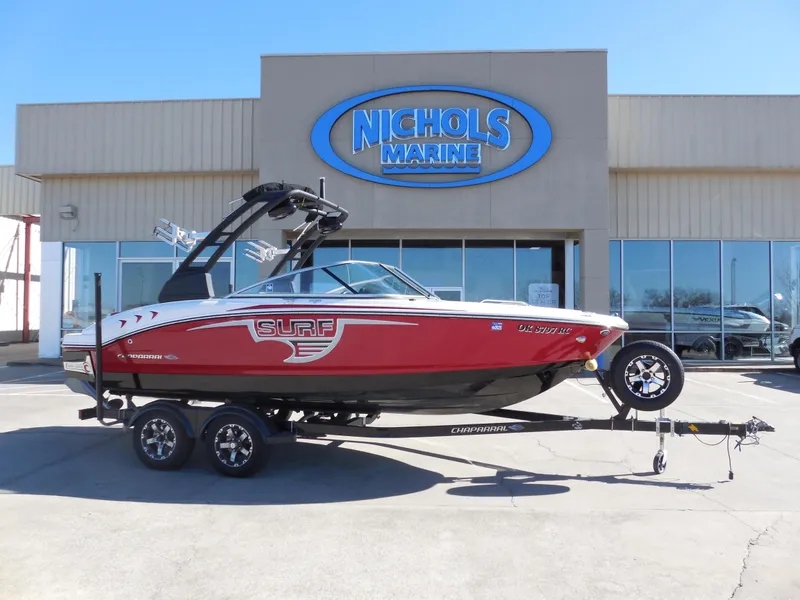 Slide: The Image of 2019 Chaparral 21 H2O Surf boat in front of Nichols Marine dealership. - 1
