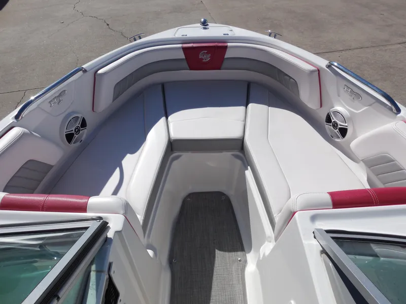 Slide: The Image of 2019 Chaparral 21 H2O Surf boat interior with white and red seating. - 10