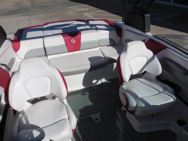 Slide: The Image of 2019 Chaparral 21 H2O Surf boat interior with white and red seating. - 12