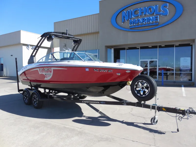 Slide: The Image of 2019 Chaparral 21 H2O Surf boat on trailer at Nichols Marine dealership. - 2