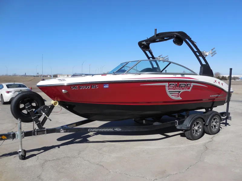 Slide: The Image of 2019 Chaparral 21 H2O Surf boat on trailer, red and black design. - 6