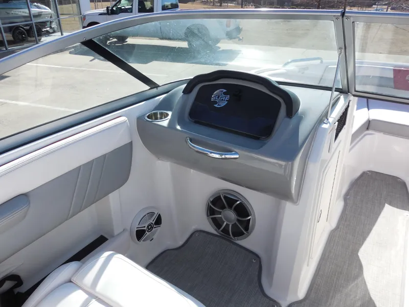 Slide: The Image of 2019 Chaparral 21 H2O Surf boat interior with dashboard and speaker. - 9