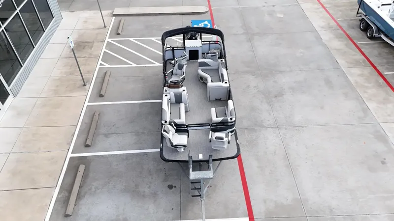 Slide: The Image of 2023 Avalon VEN 2180 FNC boat parked in a lot, aerial view. - 14