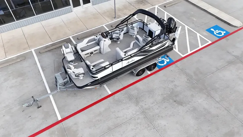 Slide: The Image of 2023 Avalon VEN 2180 FNC pontoon boat parked in a lot, aerial view. - 16