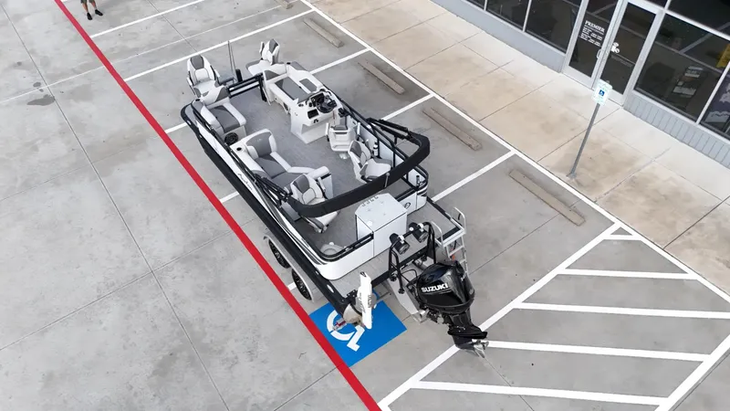 Slide: The Image of 2023 Avalon VEN 2180 FNC boat parked in a lot, aerial view. - 17