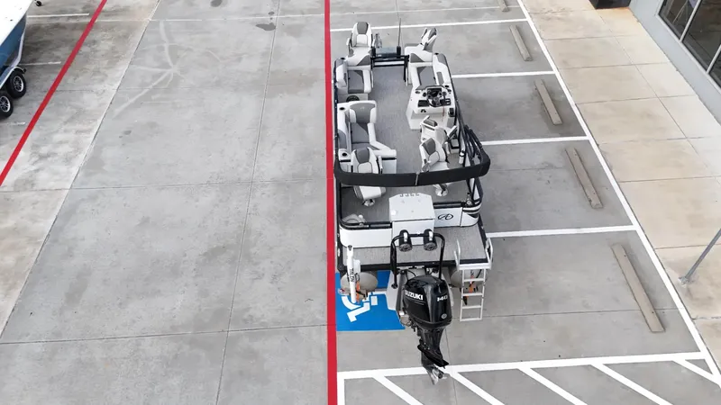 Slide: The Image of 2023 Avalon VEN 2180 FNC pontoon boat parked in a lot, aerial view. - 18