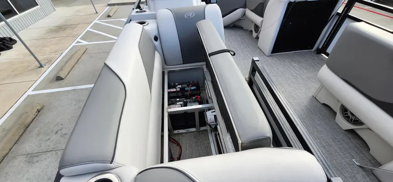 Slide: The Image of 2023 Avalon VEN 2180 FNC boat interior with open storage compartment and seating. - 21