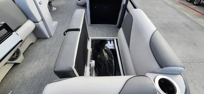Slide: The Image of 2023 Avalon VEN 2180 FNC boat interior with open storage compartment. - 22