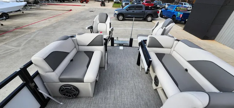 Slide: The Image of 2023 Avalon VEN 2180 FNC pontoon boat interior with gray seating and modern design. - 27